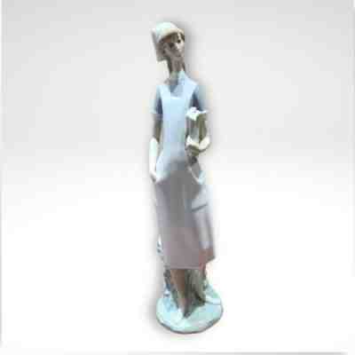 Lladro Nurse figurine in glossy porcelain with white and blue uniformÂ 