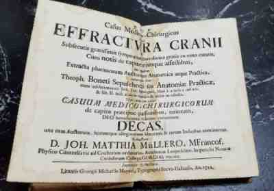 RARE ANTIQUE MEDICAL BOOK dated 1712 .... head injuries?.... vellum cover