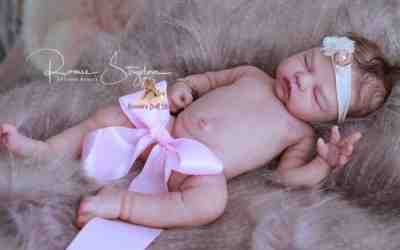 A Romie Baby*Full Bodied solid SILICONE doll sculpted & reborn by Romie Strydom