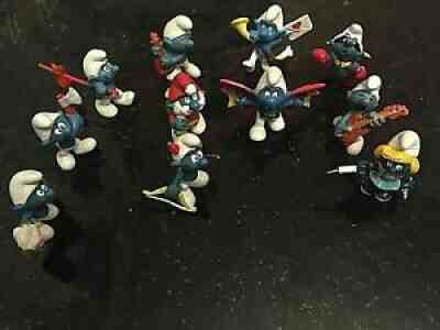 Lot of 11 smurfs *Archer, musician, nurse, backpacks, ax man, santa claus