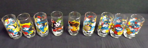 VINTAGE COLLECTION OF 9 PEYO SMURF GLASSES FROM 1982-1983 SMURFETTE GARGAMEL HOT