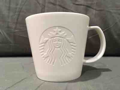 STARBUCKS Coffee Mug 2015 Solid White Etched Embossed Siren Mermaid Logo 12 oz - Sold on eBay Nov, 26th 2018 for $10.00