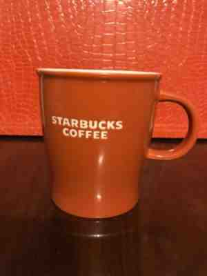 Starbucks 2009 Burnt Orange 12 Oz Mug White Recessed Lettering Bone China - Sold on eBay Apr, 29th 2019 for $15.00