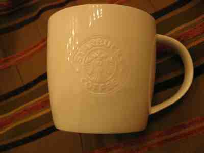 Starbucks 2009 embossed logo bone china ivory coffee mug - pre-owned - Sold on eBay Feb, 16th 2019 for $10.99