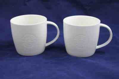 Set of 2 Starbucks Embossed Mermaid Logo Coffee Mugs 2009 White Bone China - Sold on eBay Feb, 16th 2019 for $29.99