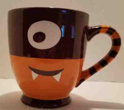  2006 STARBUCKS Orange and Brown One Eye Cyclops Monster 21 oz Coffee Mug Cup - Sold on eBay May, 14th 2019 for $29.99