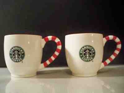 2 STARBUCKS 2010 COFFEE MUGS SNOW FLAKE RED AND WHITE STRIPED PEPPERMINT STICK - Sold on eBay May, 31st 2019 for $24.95