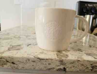 STARBUCKS White Venti (20 oz) Vente Mug Embossed Siren 2009 Mermaid Logo - Sold on eBay Jun, 9th 2019 for $24.99