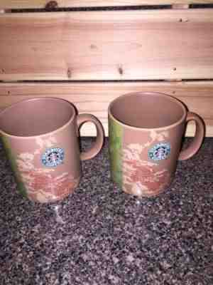 LOT OF 2 Starbucks Manolo Bean Story Coffee-Land origin mug 2006 - Sold on eBay Nov, 25th 2019 for $16.94