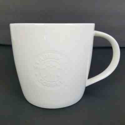 STARBUCKS Coffee Mug Cup White Embossed Bone China Mermaid Siren 2009 16 oz - Sold on eBay Dec, 9th 2019 for $19.25
