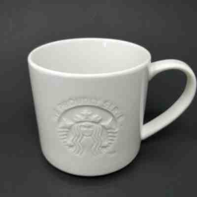 Starbucks 2012 We Proudly Serve Embossed White Coffee Mug 12 Oz. Cup - Sold on eBay Jan, 4th 2020 for $27.00