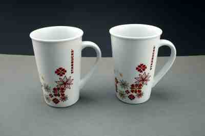 2 Starbucks Christmas Holiday 2013 Coffee Mug  Poinsettia Snowflake Star 12 oz - Sold on eBay Jan, 1st 2020 for $24.00
