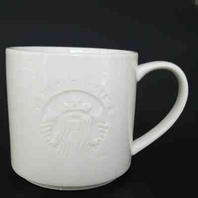 Starbucks Mug Embossed Mermaid Logo All White We Proudly Serve Coffee Cup - Sold on eBay Jan, 16th 2020 for $24.99