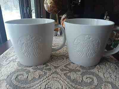 2 Excellent Starbucks White Bisque 12 oz Coffee Mugs Mermaid Embossed 2015  "T" - Sold on eBay Jan, 19th 2020 for $29.99