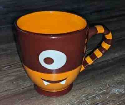 Starbucks 2006 Orange and Brown one eye cyclops monster mug 21 oz - Sold on eBay Jul 02, 2021 for $19.99