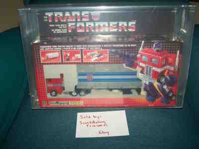 Optimus Prime G1 1984 Sealed AFA Graded 80 Canada box Metal Trailer Plates RARE
